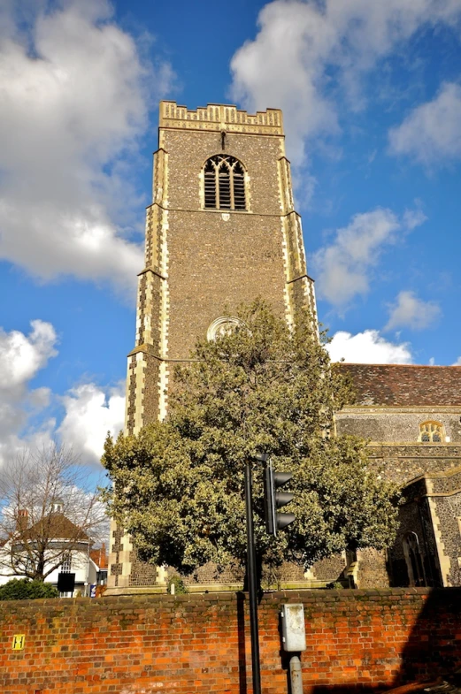 tall church with the clock tower rising into the sky