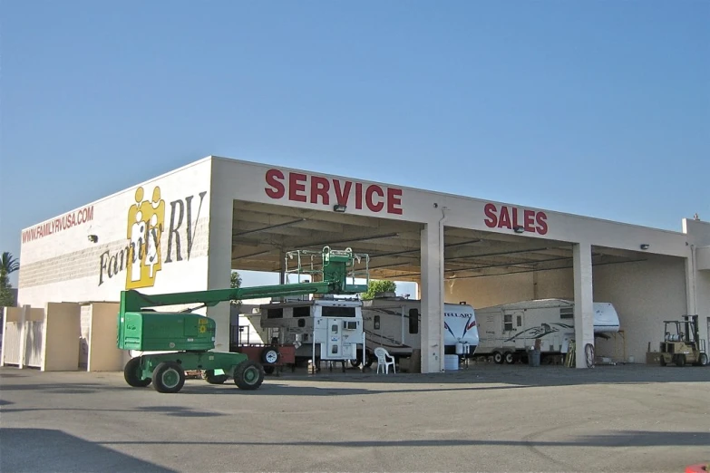 a utility truck parked in front of a service store
