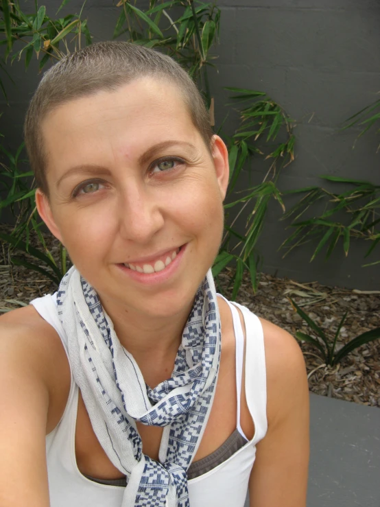 woman with grey hair wearing a scarf around her neck