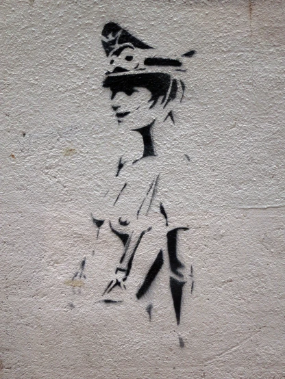 a street graffiti of a woman's head and dress