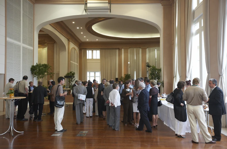 a group of people that are standing in the room