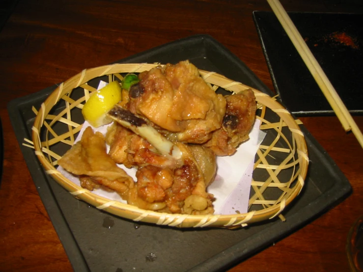 a basket filled with food on top of a wooden table