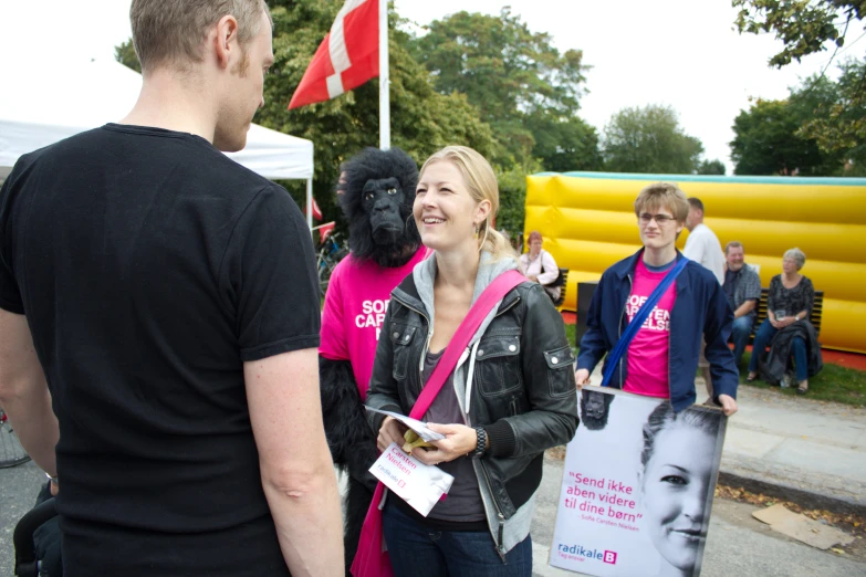 people standing next to each other wearing gorilla masks