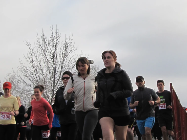 many people are in the distance running down a hill