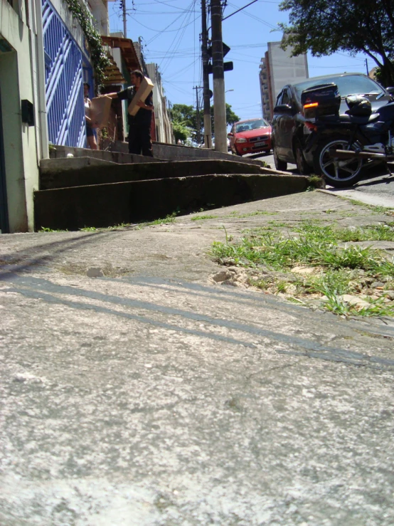 a fire hydrant next to some stone steps on a sidewalk