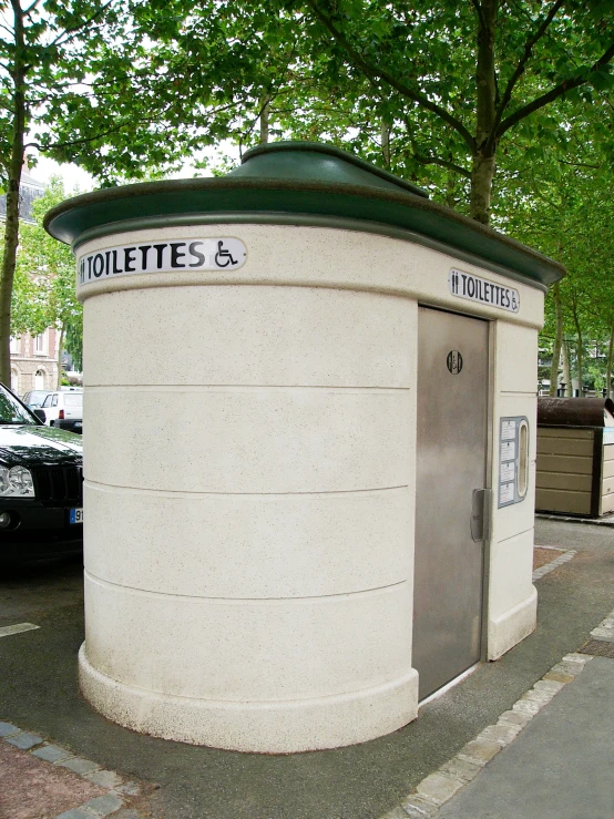 there is a white bathroom with green roof