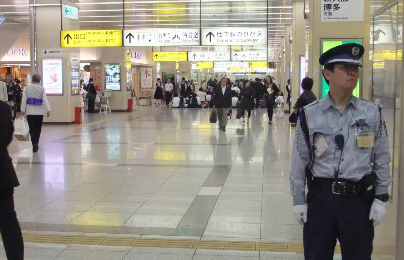 two police officers stand together in a building