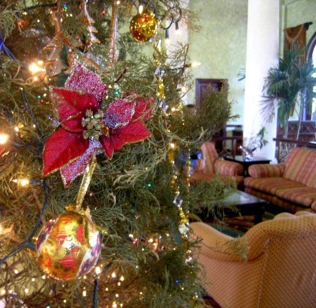 the christmas tree has been decorated with bright ornaments