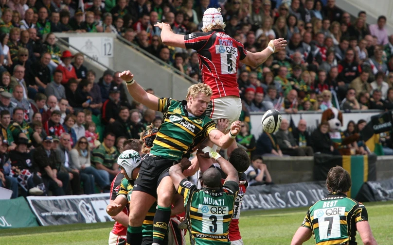 a group of young men playing a game of rugby