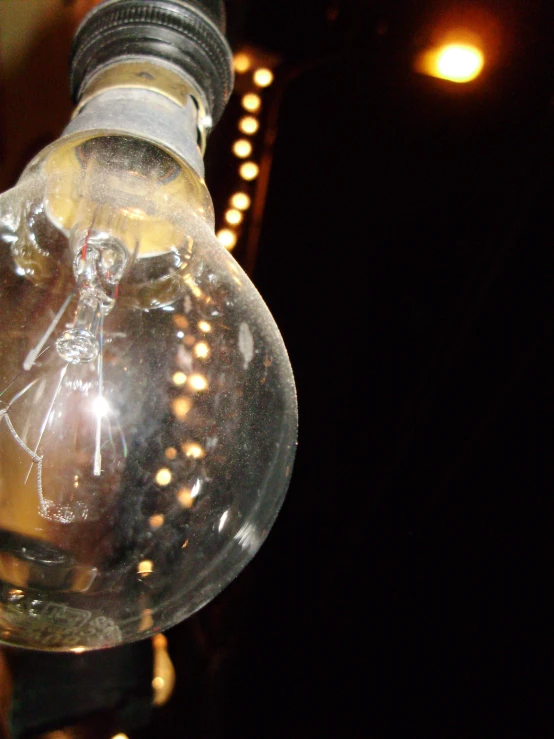 a glass light bulb that has a drawing on it