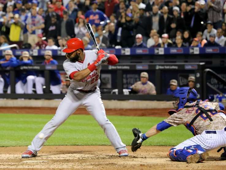 a baseball player holding a bat during a baseball game