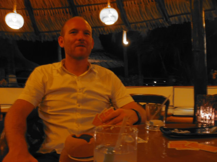 a man sitting at a table full of plates of food