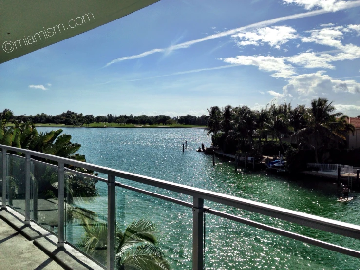 a balcony with sea view looking towards a marina