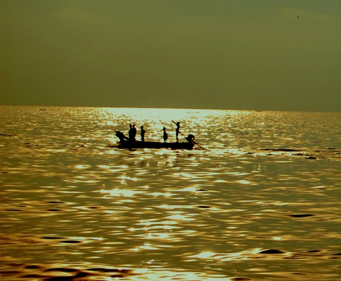 people in a boat out on the open water