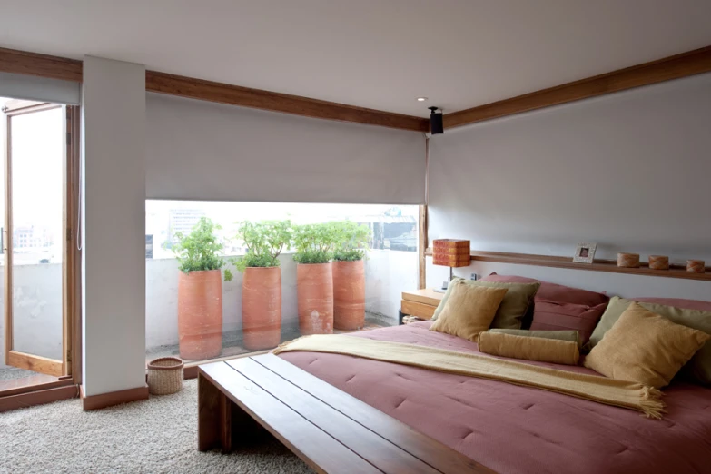 a large bed sitting next to an open window