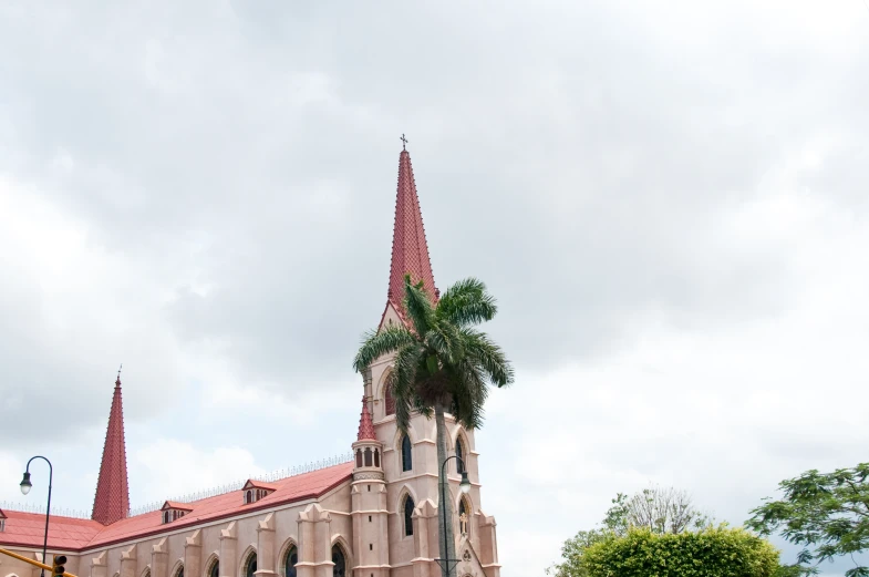 a very tall church with two clocks on each side of it