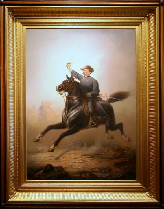 a framed picture of a man riding a horse