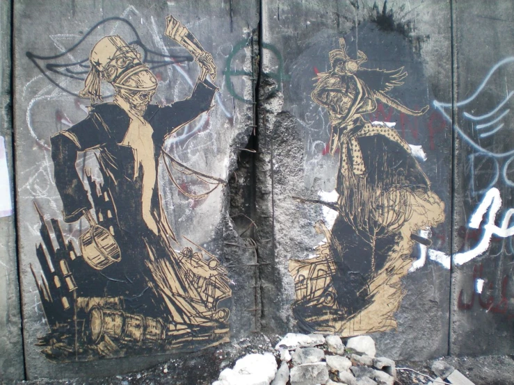 two identical paintings on the side of a wall covered in graffiti