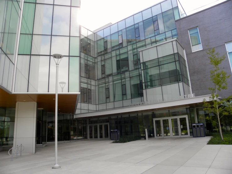 two different buildings in front of one another with a walkway