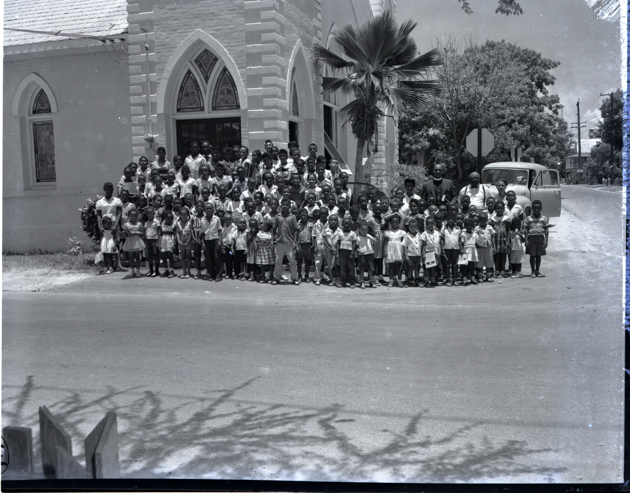 a group of people posing for a black and white po