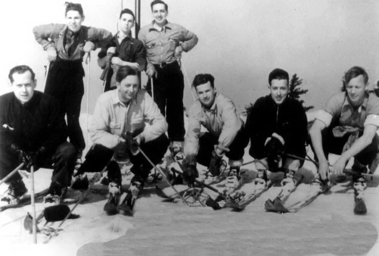 the men are posing for a picture in their black and white po