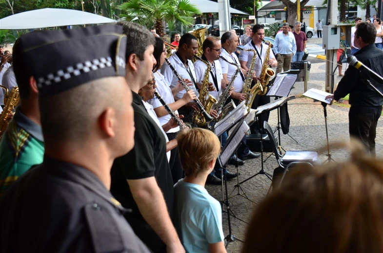 a group of people play music on the street