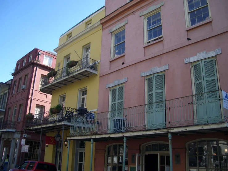 the windows and doors of a building are painted pink