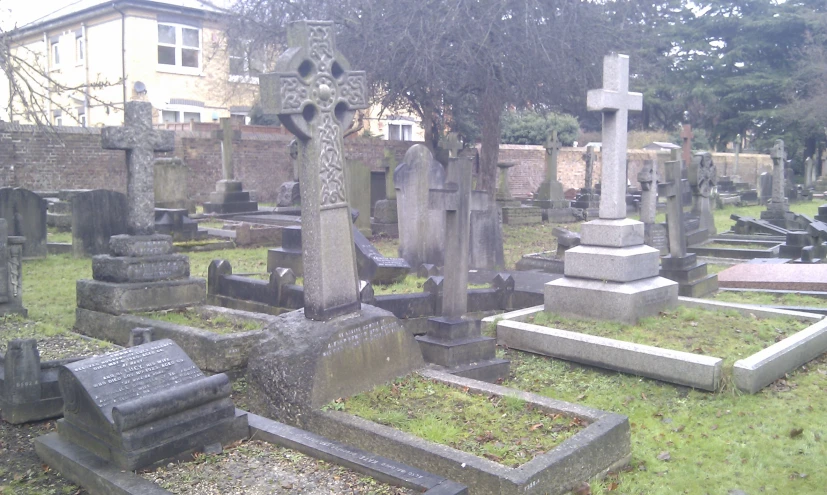 a cemetery with many different headstones in it