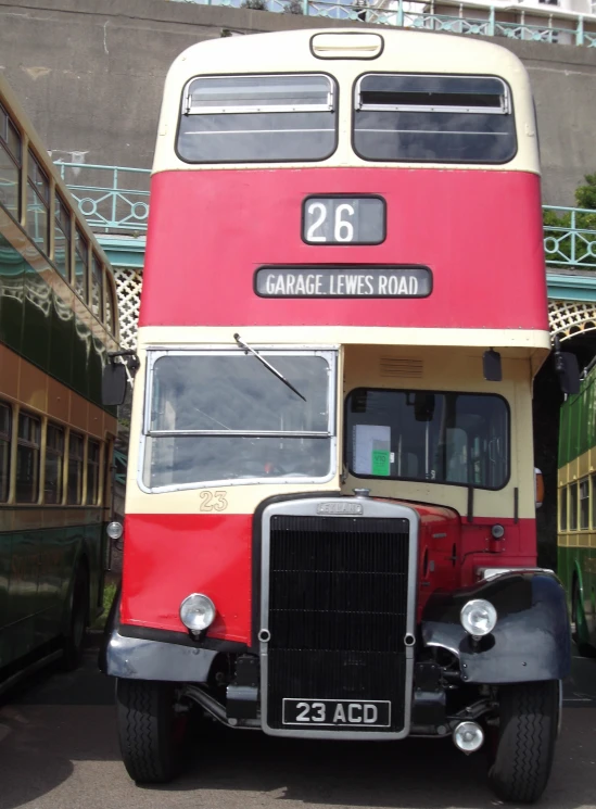 a double decker bus that is parked next to another bus