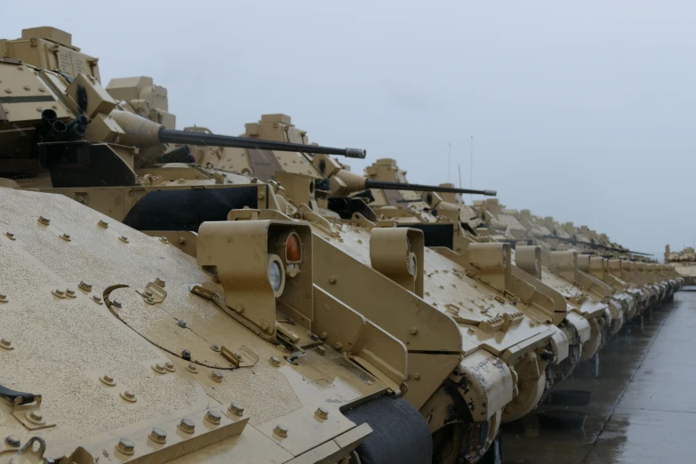 a bunch of tanks are lined up in a row