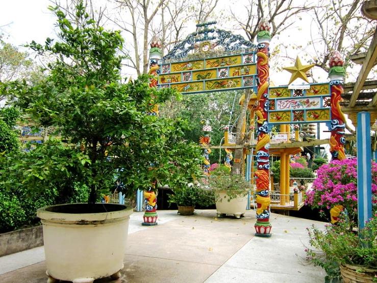 a walkway with an archway decorated in oriental ornaments