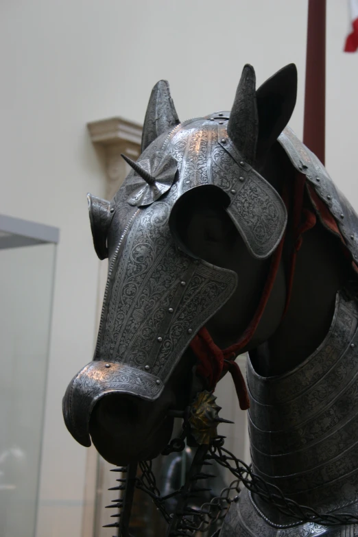 a metal helmet is on display on a table