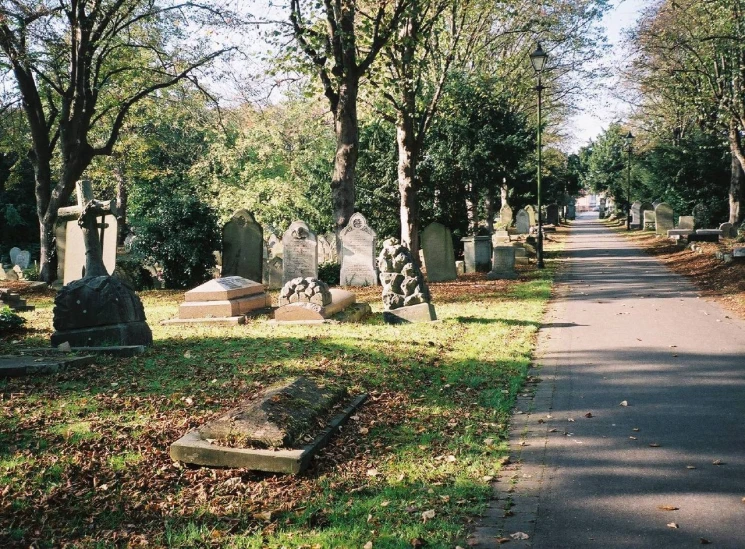 an old cemetery sits empty in front of the gravestones
