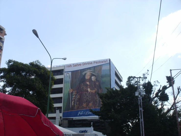 a large advertit for an indian fashion nd in front of a building