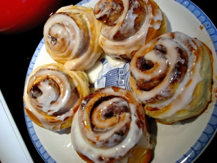 six baked pastry items on a plate ready to be eaten