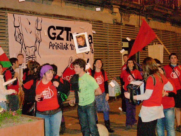 a large group of children standing on the street