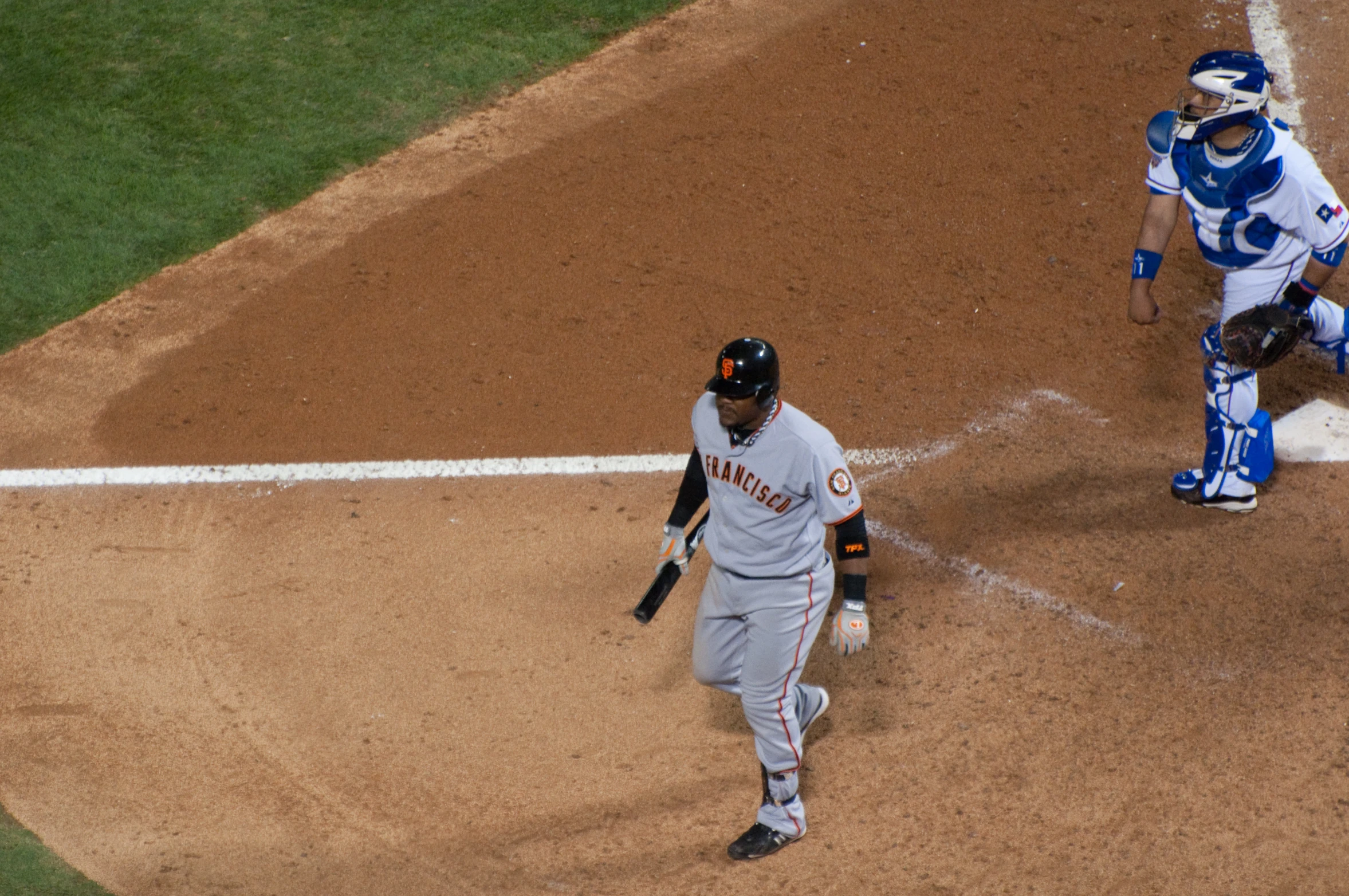 some baseball players are playing baseball on the field