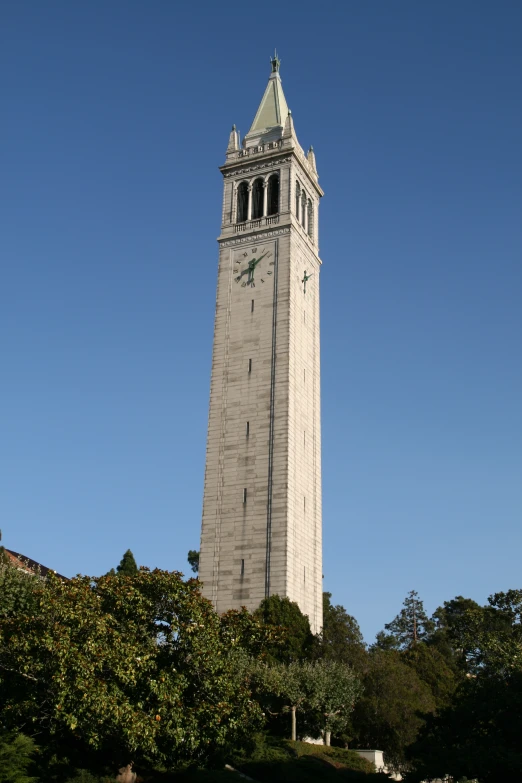 the large clock tower is tall in the sky