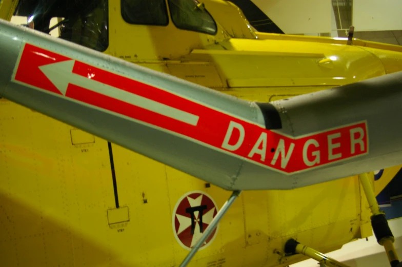 the back of a helicopter with a red danger sign on it