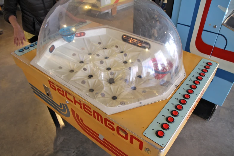 an arcade game in a museum, including a snow globe