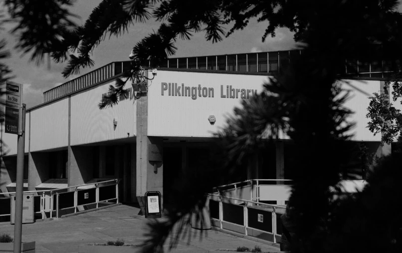 there is a building that has been placed in the black and white pograph