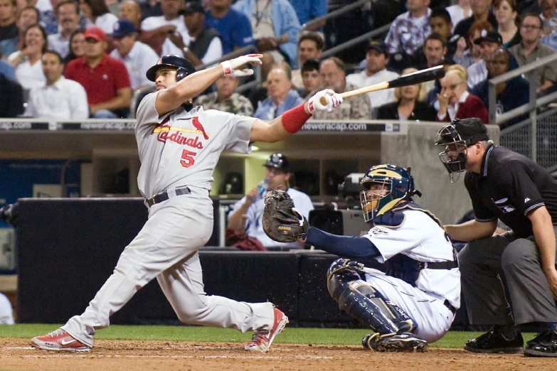 a baseball player swinging a bat on a field