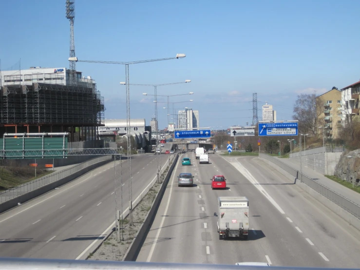 two lane highway with cars, and one car coming towards the right