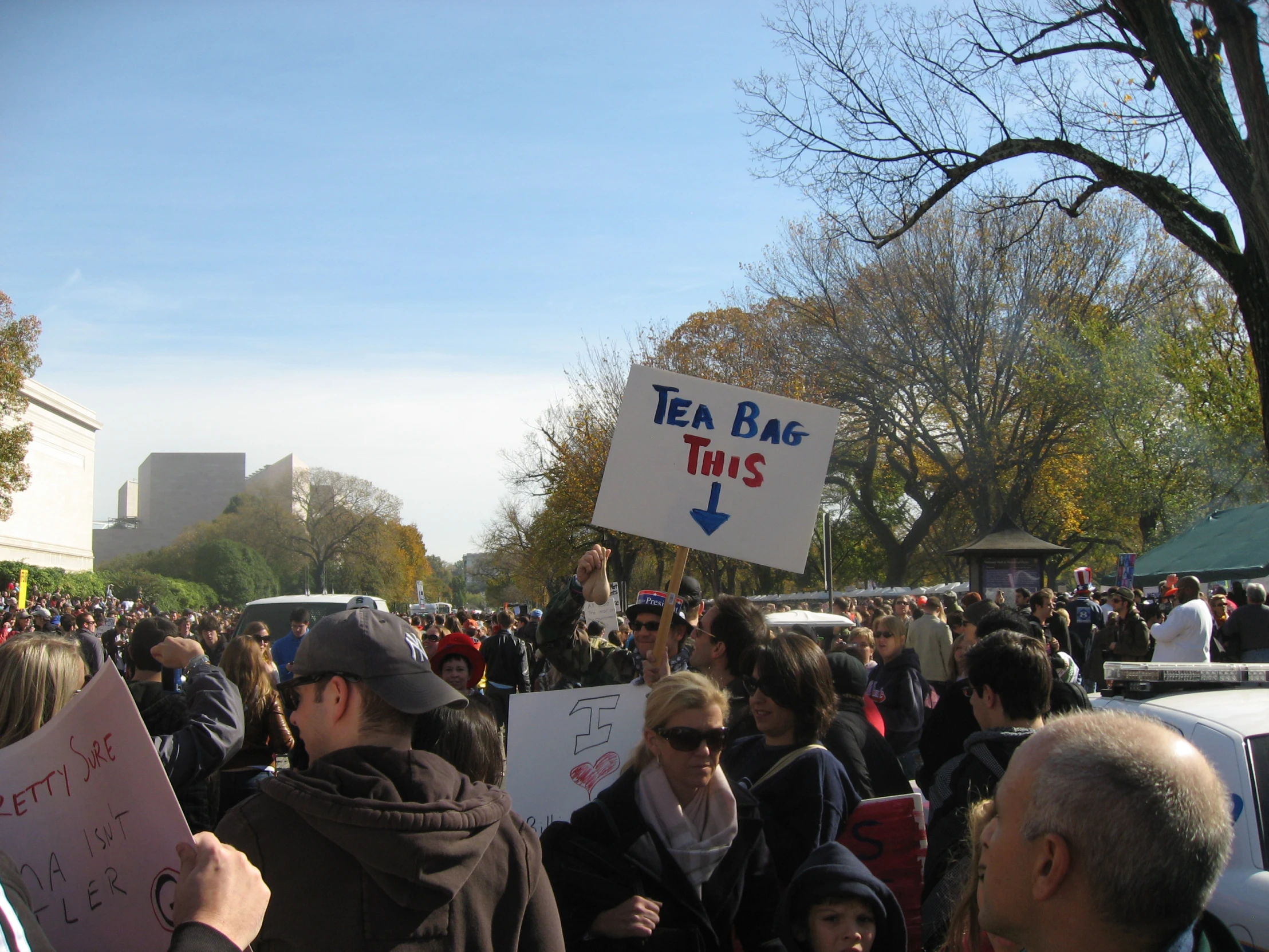 large group of people at an event with signs in front of them