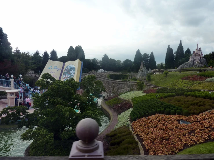 a miniature model in a park with people walking