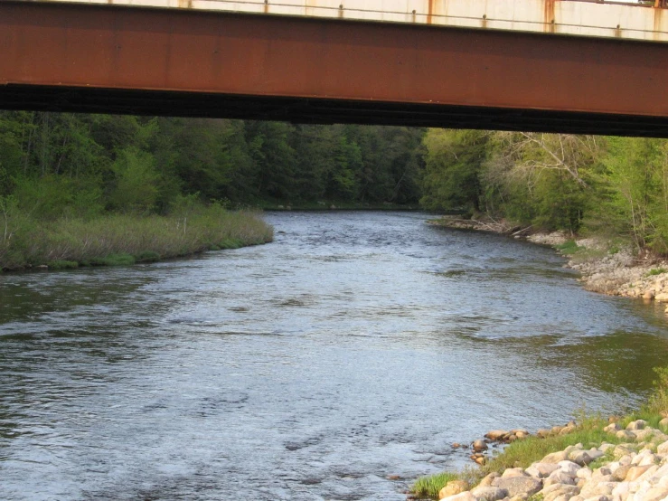 a bridge that is spanning over a river