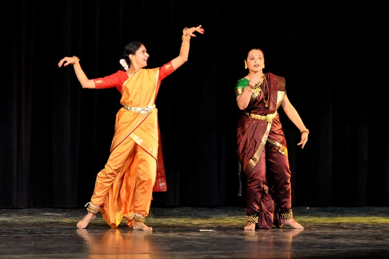 a couple of women that are on stage