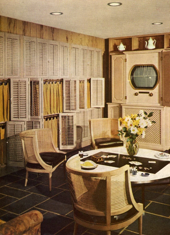 an old pograph of a dining area with chairs and a table