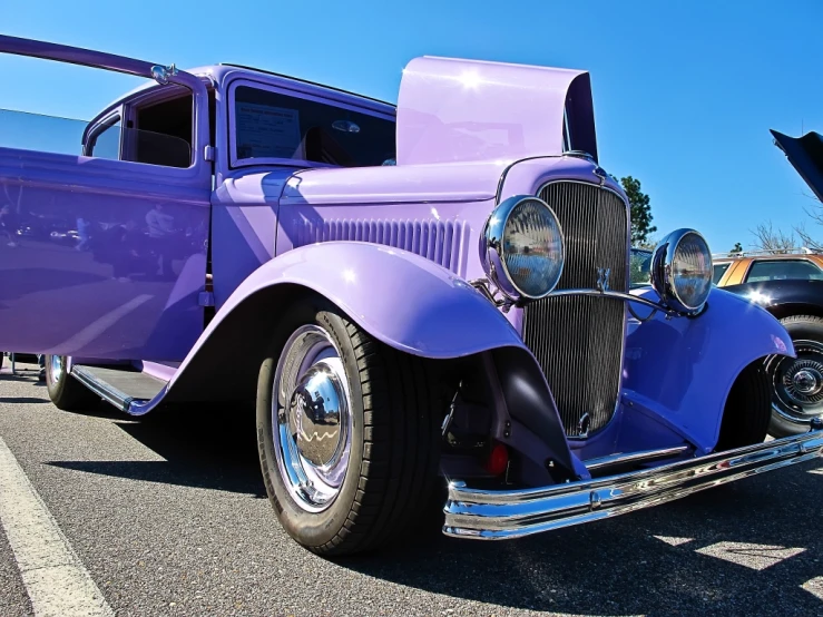 vintage cars parked near each other in parking lot