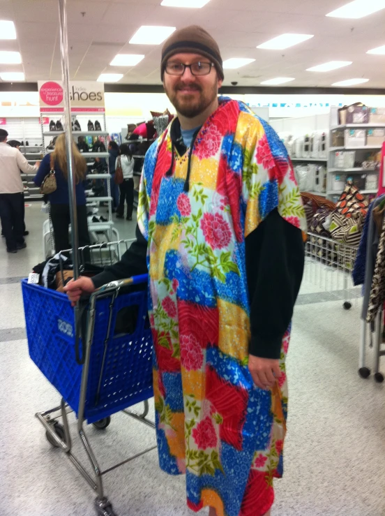 a man in colorful clothing at the grocery store